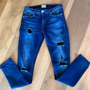 Hudson mid rise ripped jeans with cute black threading on the rips.